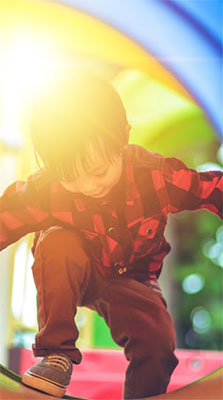 boy on a park tunnel