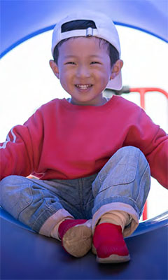 little boy on a slide