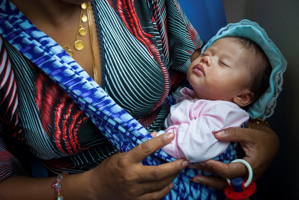 Photo of mother holding a baby