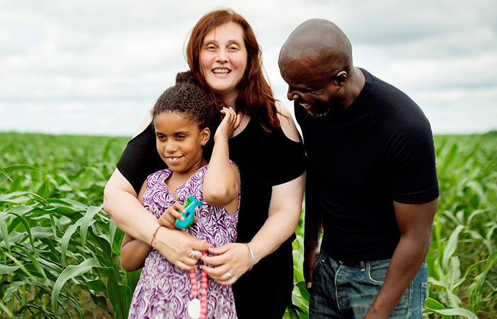 happy family together in a field