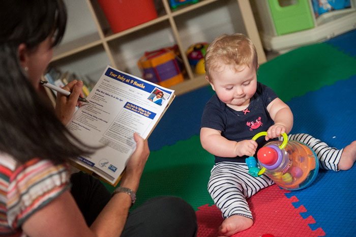 A child playing with a toy at day care