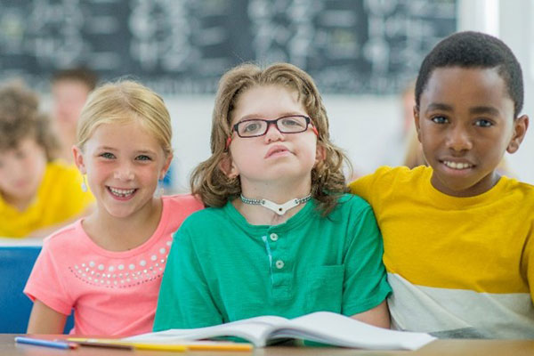 Child with disability at school with friends