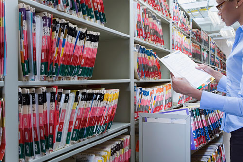 healthcare administrator reviewing patient files