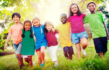 Large group of children walking outdoors