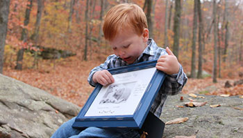 Miles' brother holding his photograph