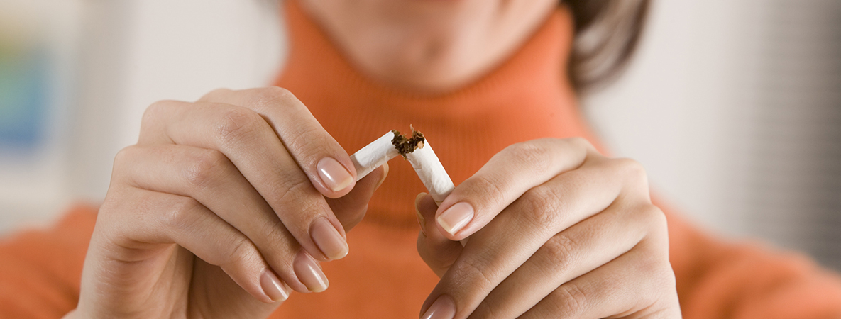 Woman breaking cigarette