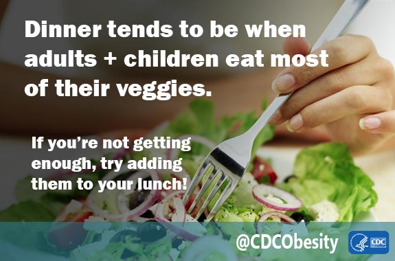 A woman eating a salad.