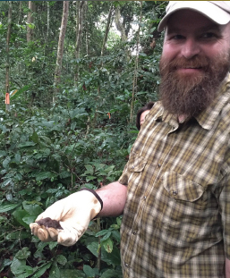 man holding a rodent