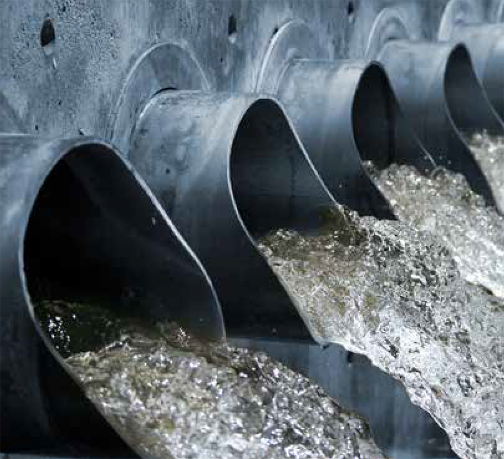 Water flowing out of sewer drains