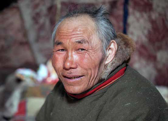 Close-up portrait of Nenets in national clothes of the peoples of the far north