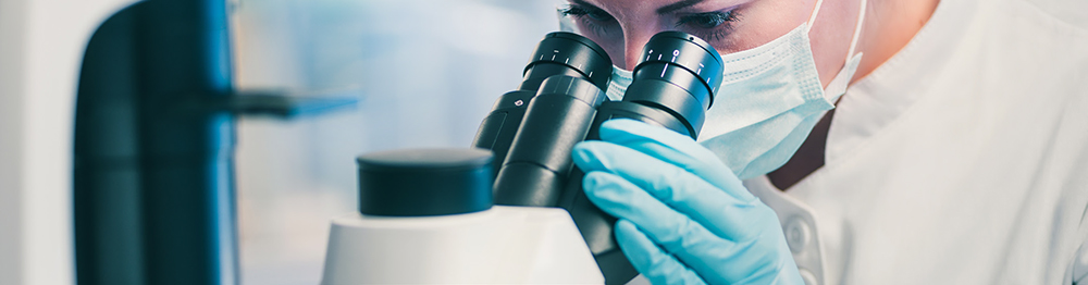 Microbiology, laboratory technician observing bacteria strains