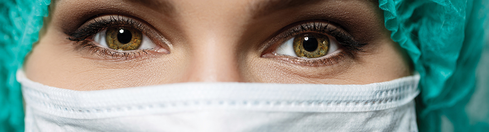 Female doctor's face wearing protective mask