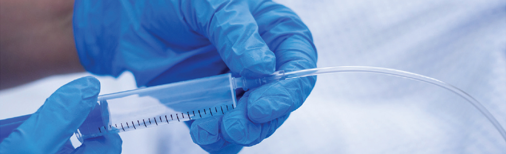 A scientist holding a tube