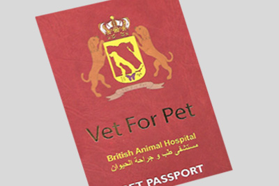 Cropped image of a red passport book an official-looking emblem featuring pets and a crown