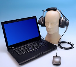 NIOSH HPD Well-Fit&trade; fit-testing system for earplugs shown with laptop and manikin with headphones.