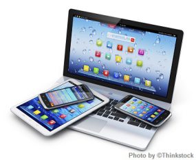 a laptop, tablet, and two mobile phones