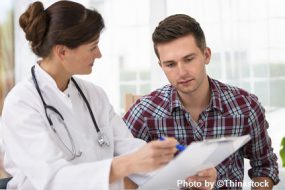 a doctor discussing sleep medicine with a male patient