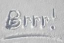 The word Brrr written in the snow.