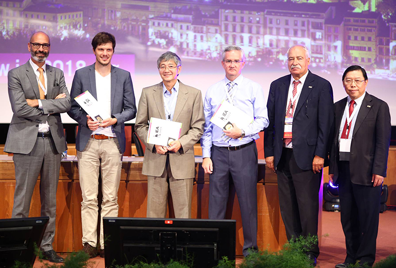 Awardees stand on stage after receiving medals