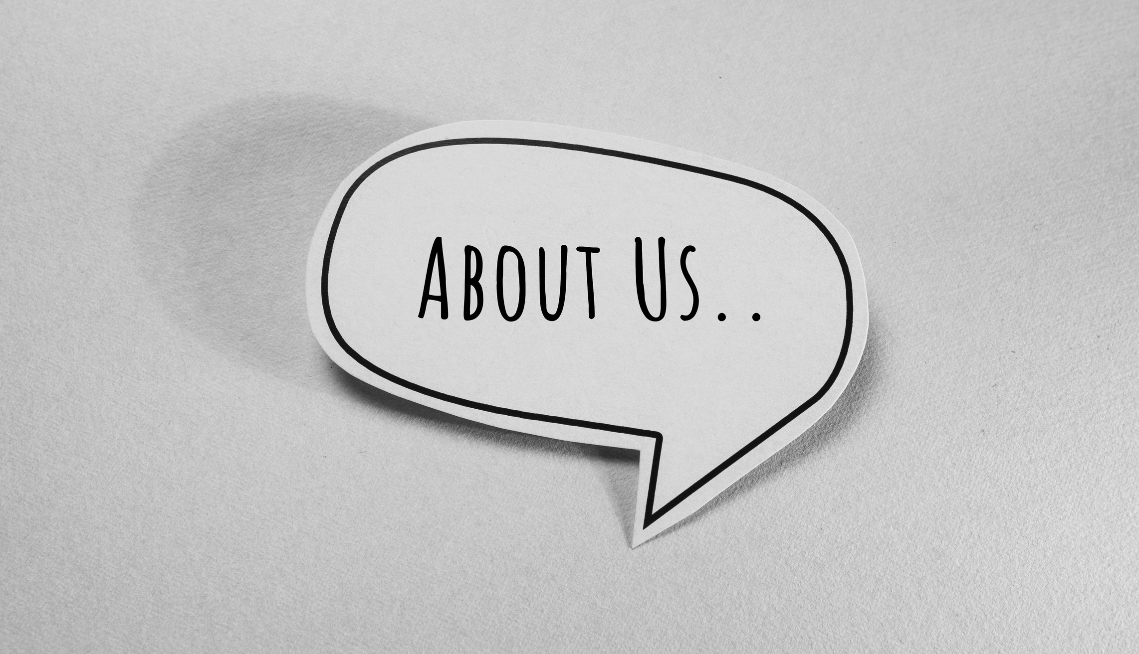Speech bubble with "About Us" text