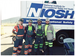 Miners in front of NIOSH mobile screening clinic