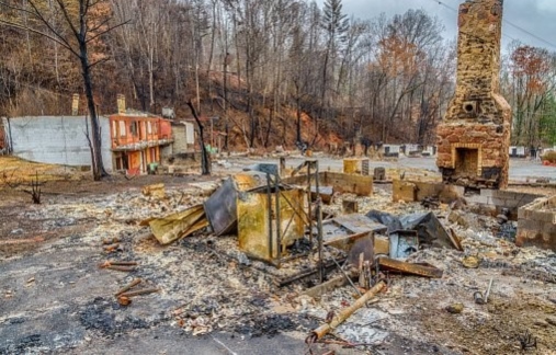 Demolished house with chimmney only standing