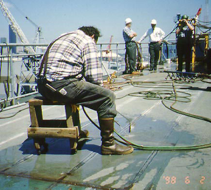 Worker using a wheeled stool