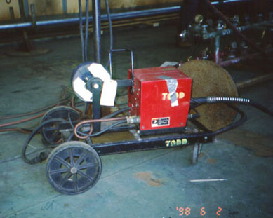 Wire welding unit on a wheeled dolly