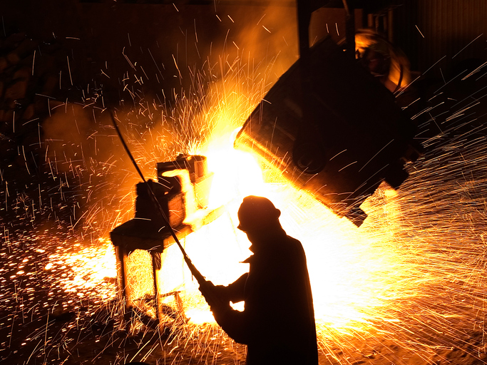 Steel foundry with worker present