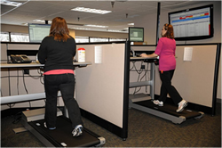 employees with treadmills at their desks