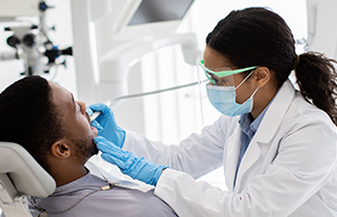 Female dentist with male patient