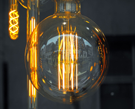 Photo shows lightbulb innovations (a large globe and elongated versions). Free photo.