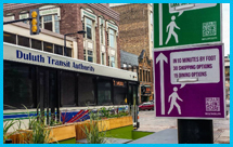 Photo of a mass transit buss driving down a street in Minneapolis, MN.