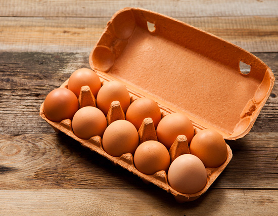 Image of a carton of brown eggs.