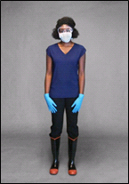 Women healthcare work wearing a mask, aglove, and boots