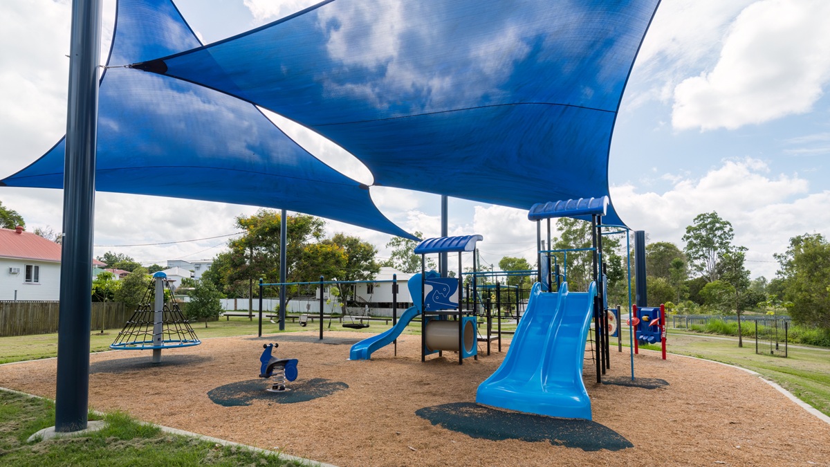 A children's playground with shade sails