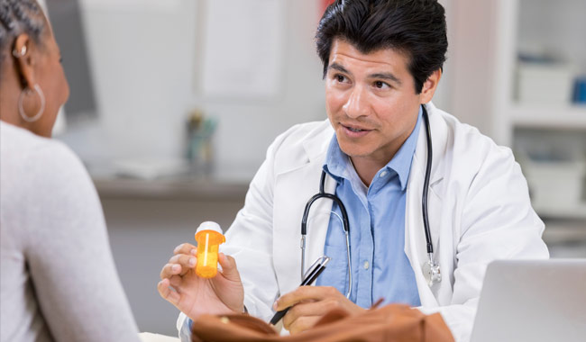 doctor discussing medication with patient