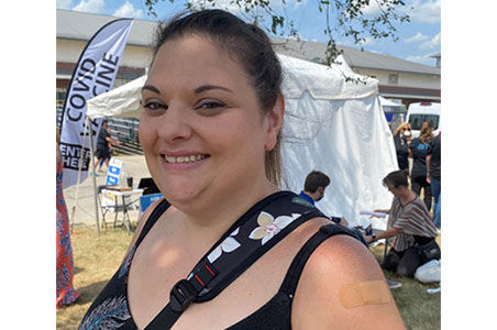 Wisconsin resident shows her vaccine bandage