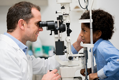 young boy getting eye exam