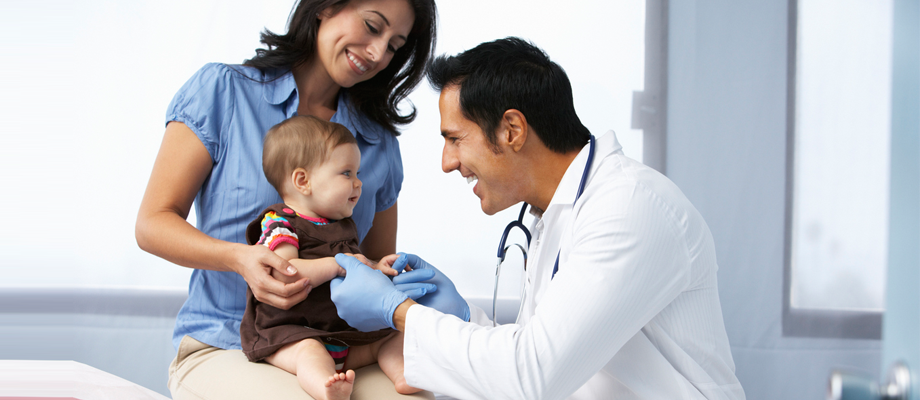 Mother and baby visiting doctor